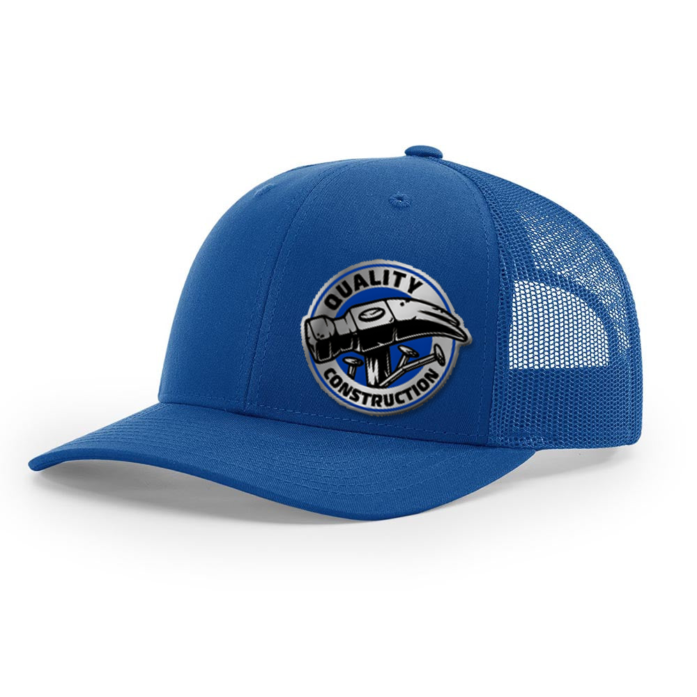 A blue Richardson 112 Snapback Trucker Cap with a custom acrylic patch on the front.