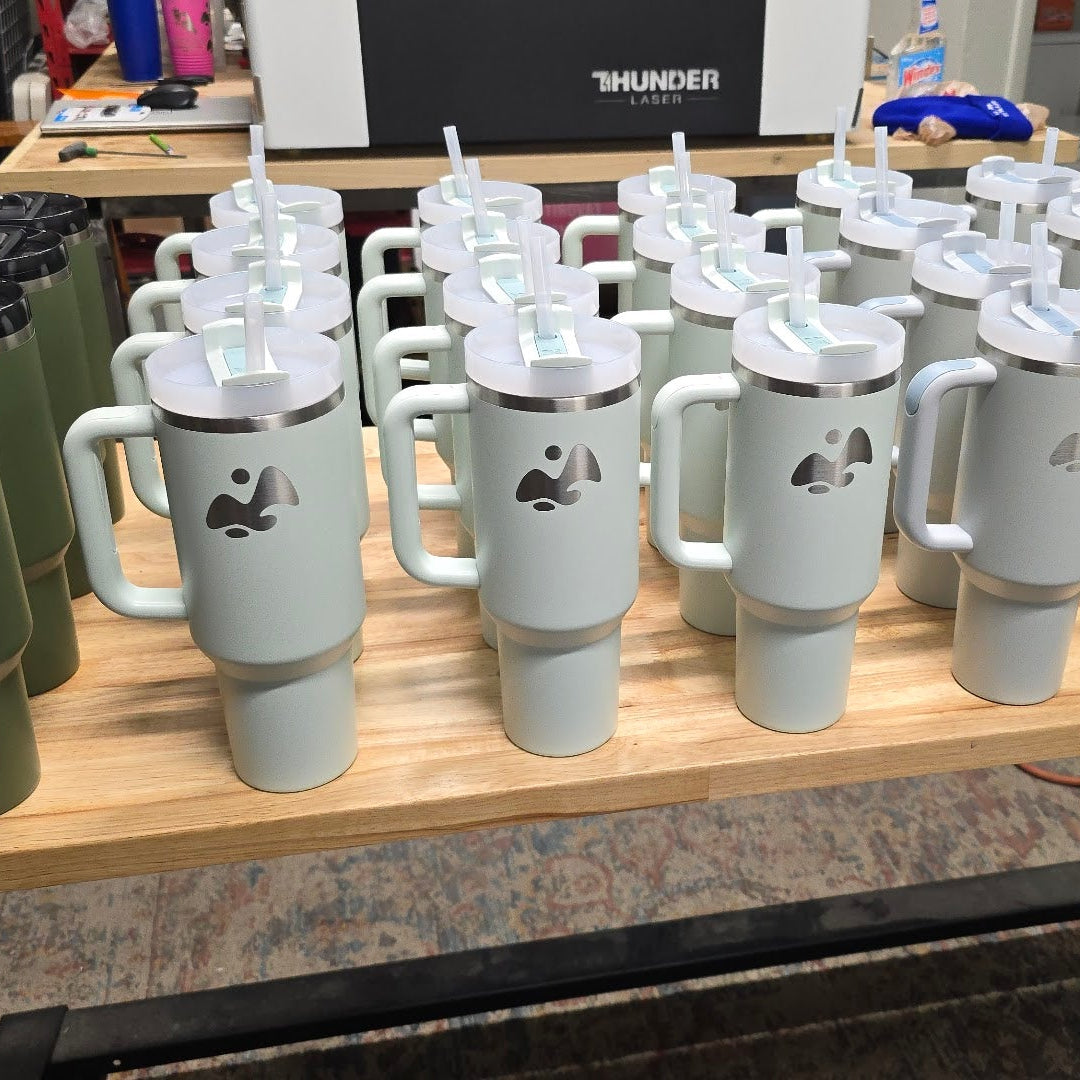 Custom laser engraved Stanley 40oz tumblers with business logos created at Lucky Dog Branding in Idaho Falls